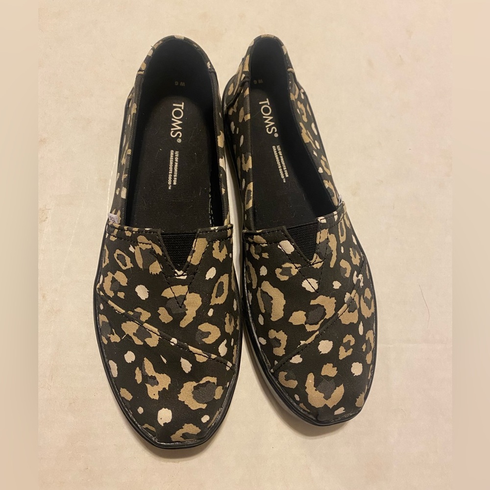 Tom’s black abstract leopard print loafer slip on shoes